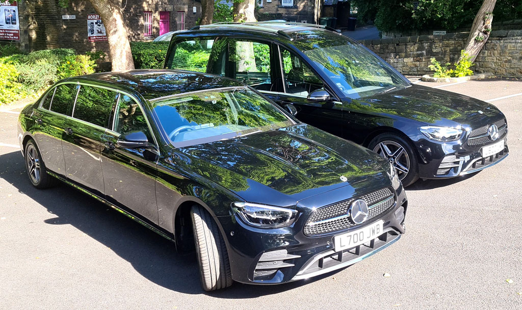 Black Mercedes-Benz hearse parked outside JW Binks